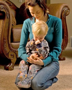 Mormon mother praying with child