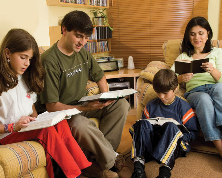 Mormon family reading scriptures